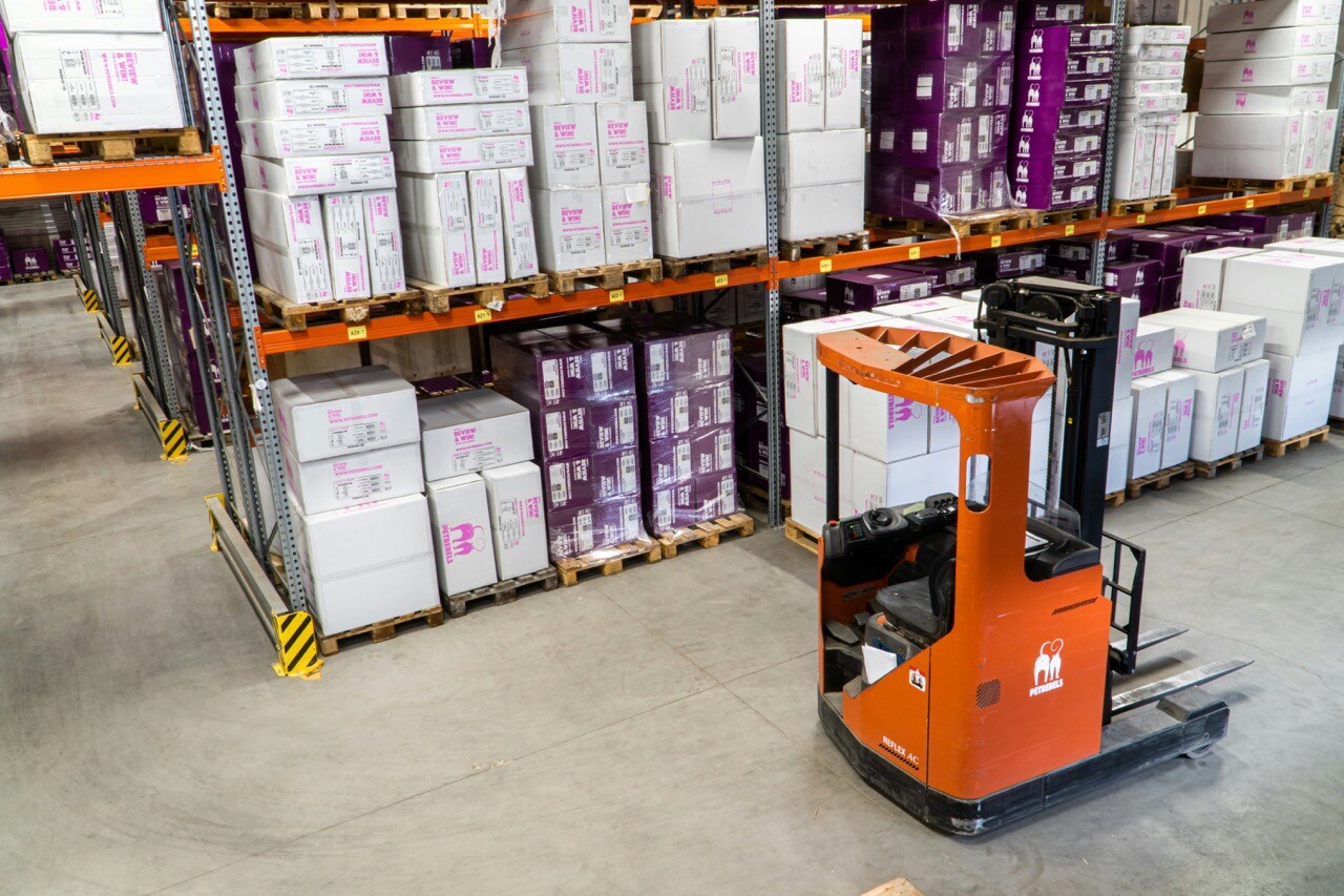 A warehouse with a fork lift