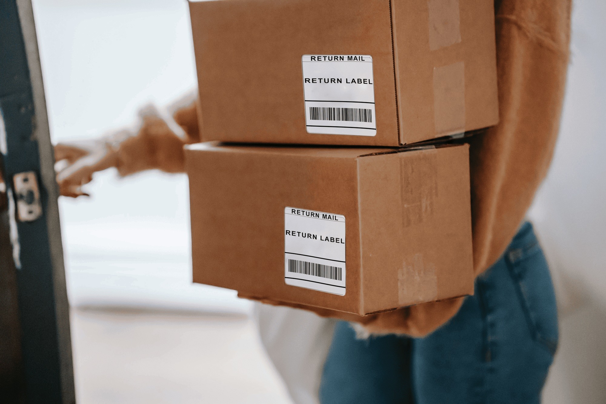 Someone bringing packages with return labels to post office